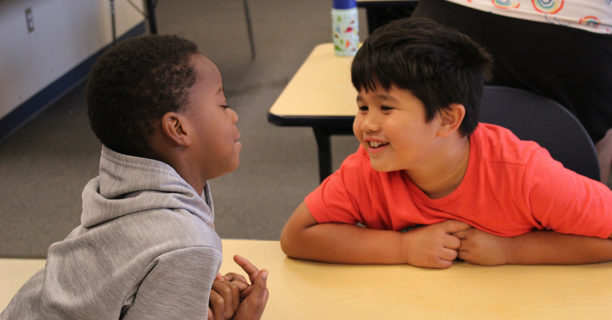 boys smiling at one another
